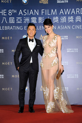 Celebrity Juror of the 8th Asian Film Awards Donnie Yen arrives on the red carpet hand-in-hand with his wife Cecilia Wang