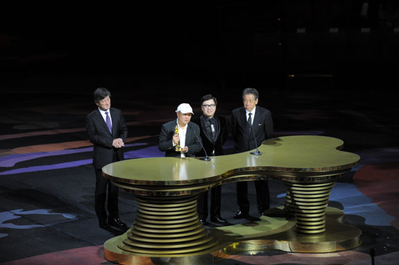 Mr Hou Hsiao Hsien receives the top honour at the 8th Asian Film Awards ceremony, the Lifetime Achievement Award, from the executive committee members of the AFAA