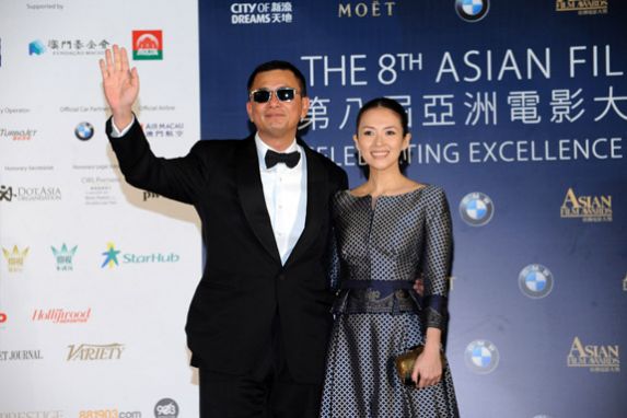Film Director Wong Kar Wai arrives on the red carpet with Actress Zhang Ziyi